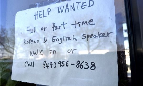 A hiring sign is displayed at a restaurant in Mount Prospect, Ill., Feb. 1. On July 25 the Labor Department reports on the number of people who applied for unemployment benefits last week.