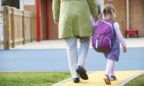 back to school, parents and kids walking to school